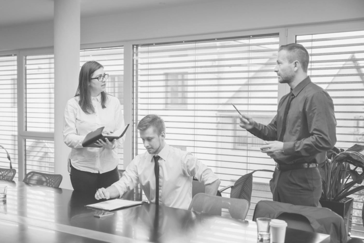 Students collaborating on financial planning exercises with worksheets and calculators