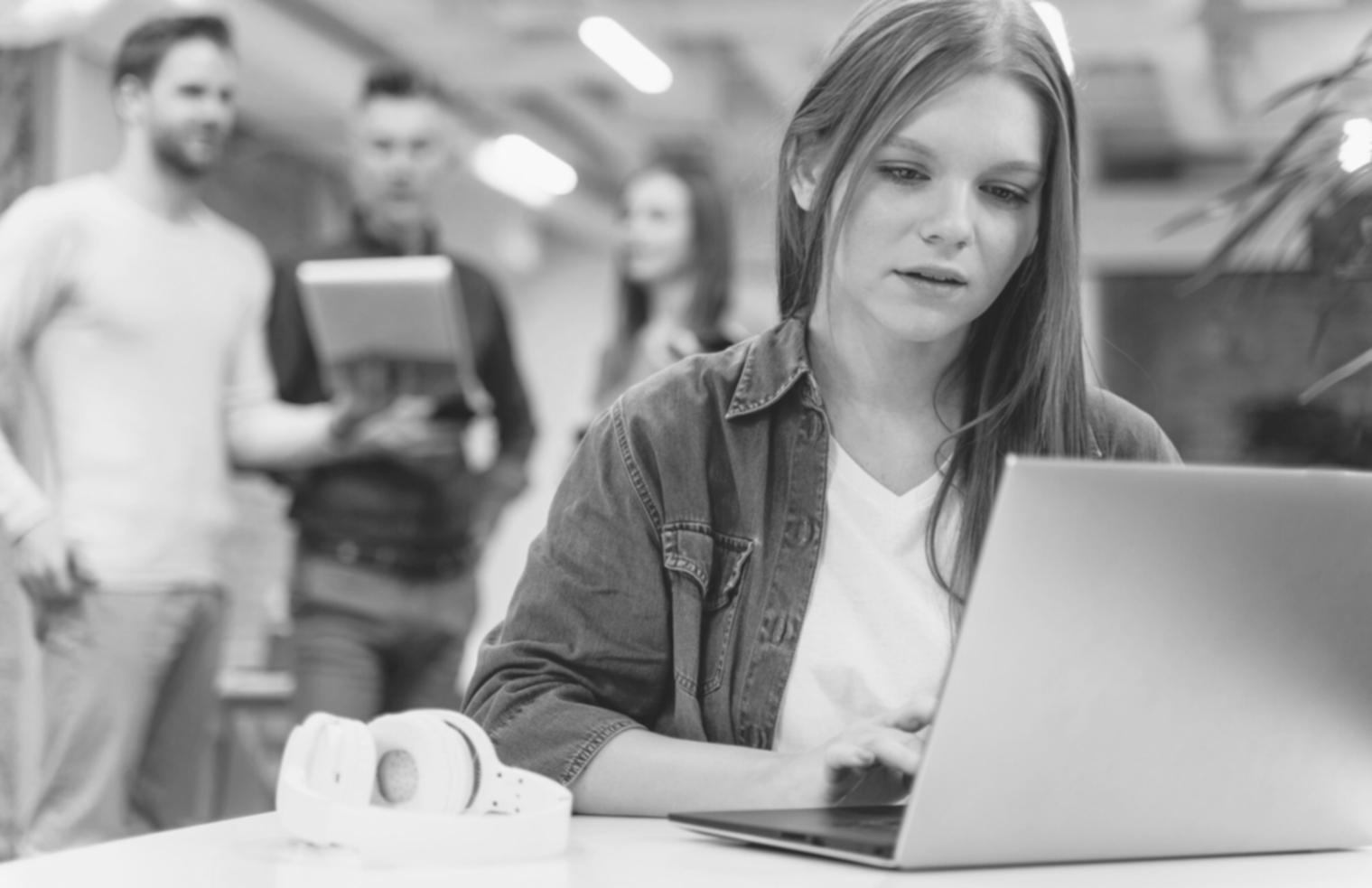 Professional working at desk with financial documents and calculator