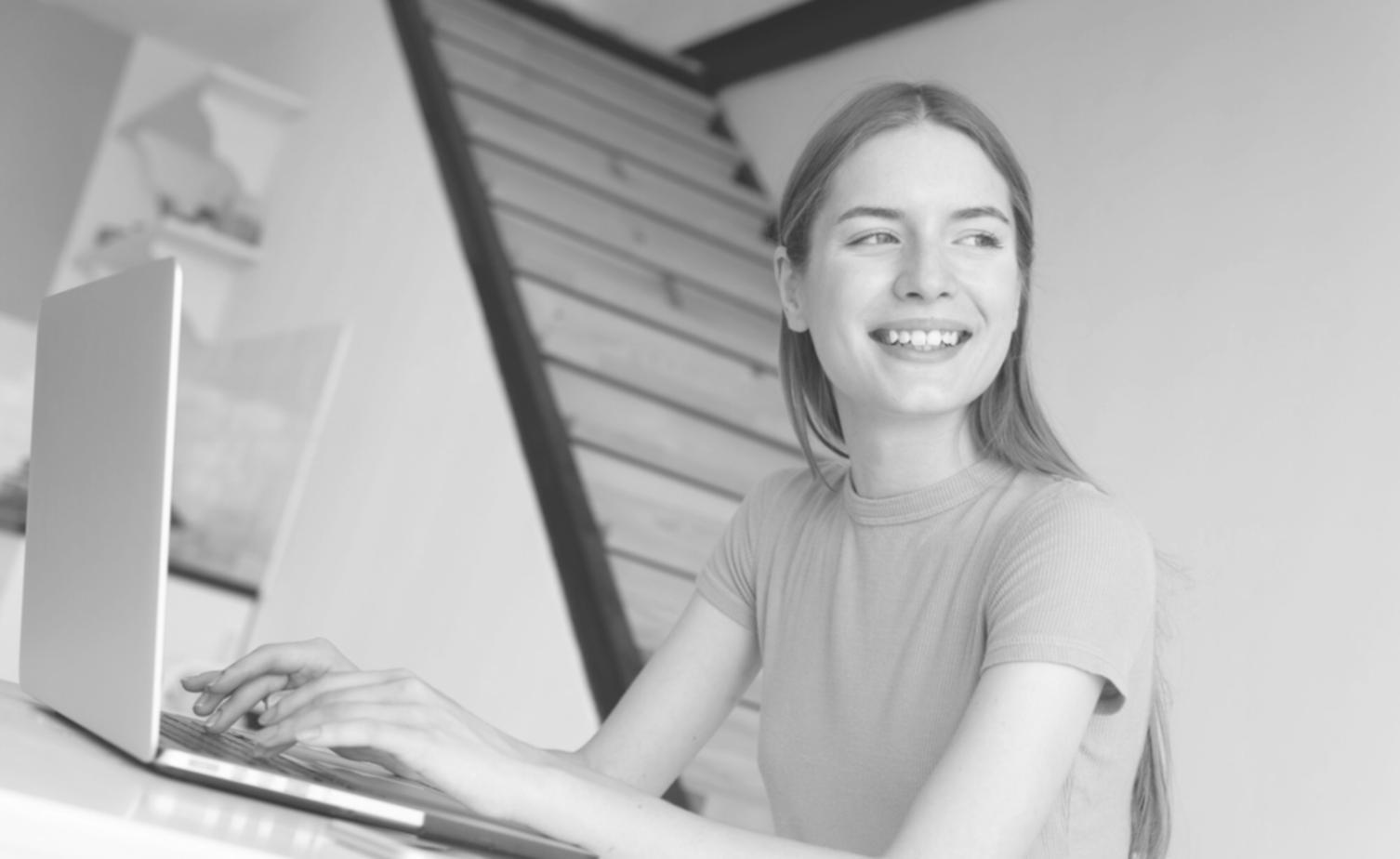Organized desk with financial documents, calculator, and laptop showing tax preparation workflow