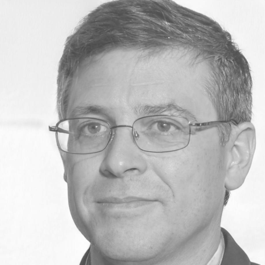 Professional financial educator in business attire smiling confidently