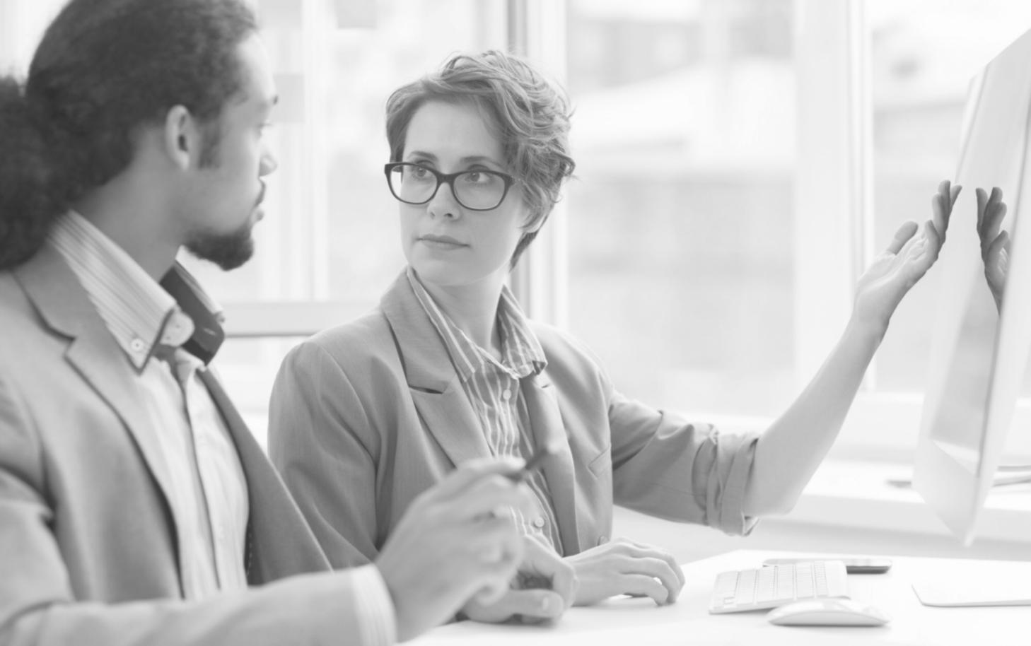 Interactive learning session with participants discussing real financial scenarios around a table
